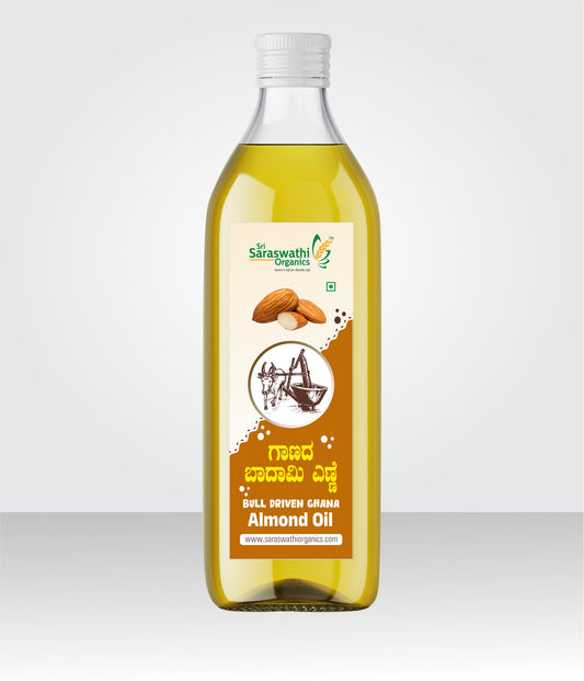 Bottle of almond oil with a label on a white background