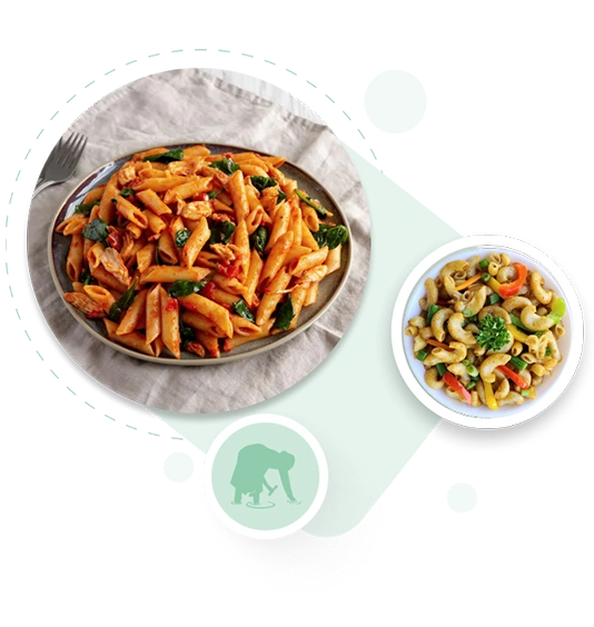 Two plates of pasta with vegetables on a white background