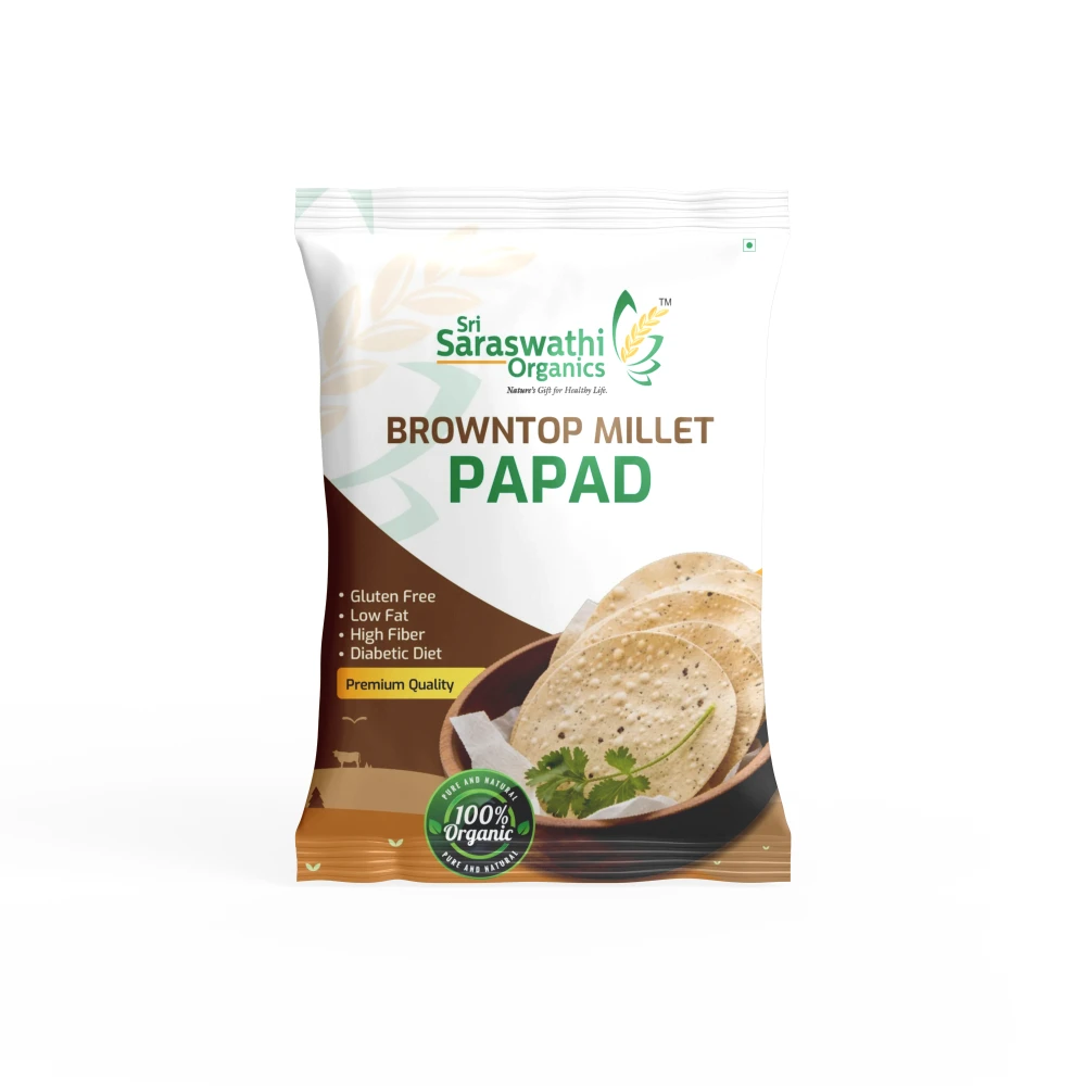 Packaged brown top millet papad with Saraswathi Organics branding on a white background