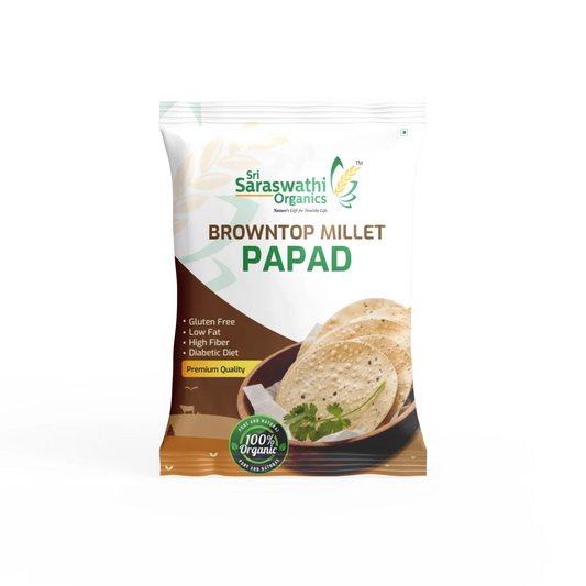 Packaged brown top millet papad with Saraswathi Organics branding on a white background