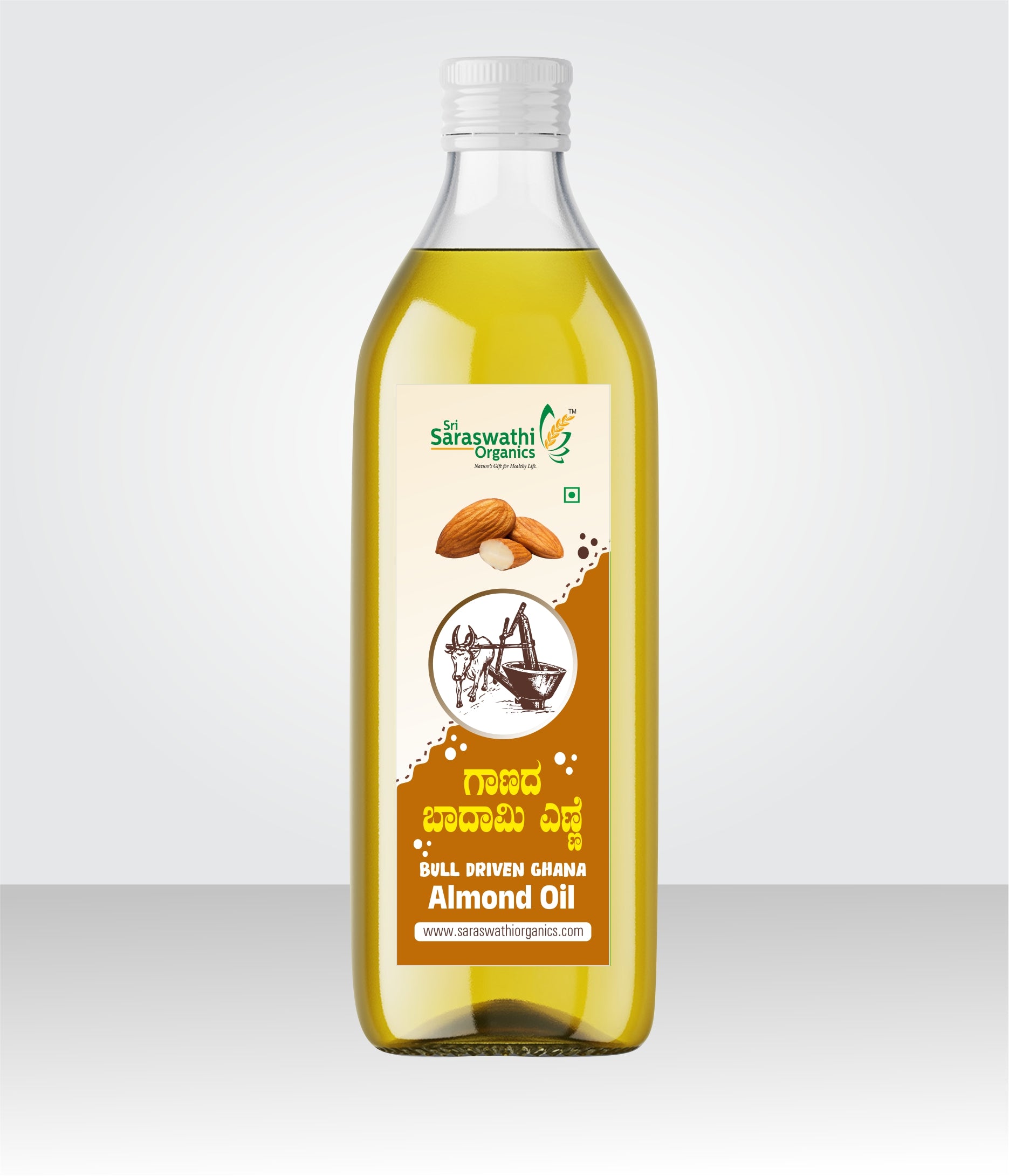 Bottle of almond oil with a label on a white background