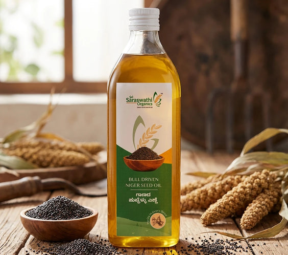 Bottle of Saraswath Organics bull driven niger seedoil with niger seeds on a wooden surface